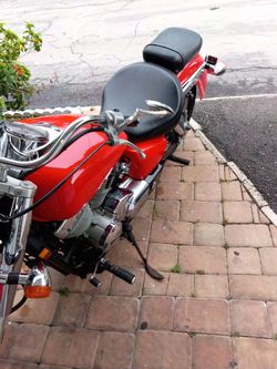 Red Cruiser Motorcycle with Chrome Accents.  Honda Shadow