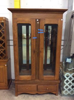 Antique glass display cupboard with three shelves and two cupboards