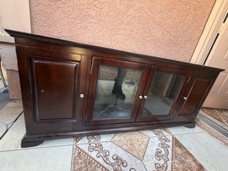Dark wood TV/media console with glass doors