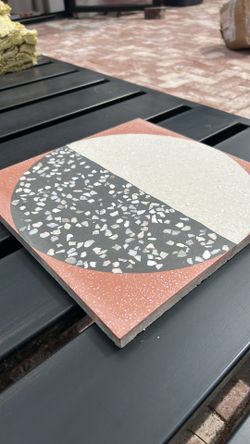 Modern 12x12 terrazzo tiles from Zia Tile in Highball Rust