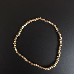 Gold color bracelet with matte faceted beads