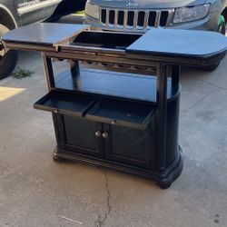 Home Style Bar Cabinet Black With Side To Side Slideable Top And Wheels  
