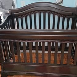  Baby Cache Riverside 4-in-1 convertible crib in an espresso finish. 