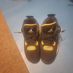 Air Jordan 4 Black and Yellow Sneakers
