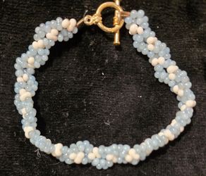 Small Handmade Blue and White Beaded Toggle Clasp Bracelet with a spiraling Kumihimo design