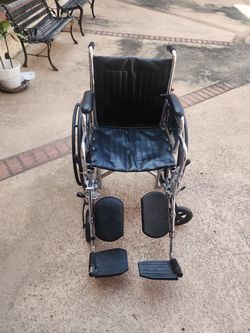 WHEEL CHAIR CHROME AND BLACK