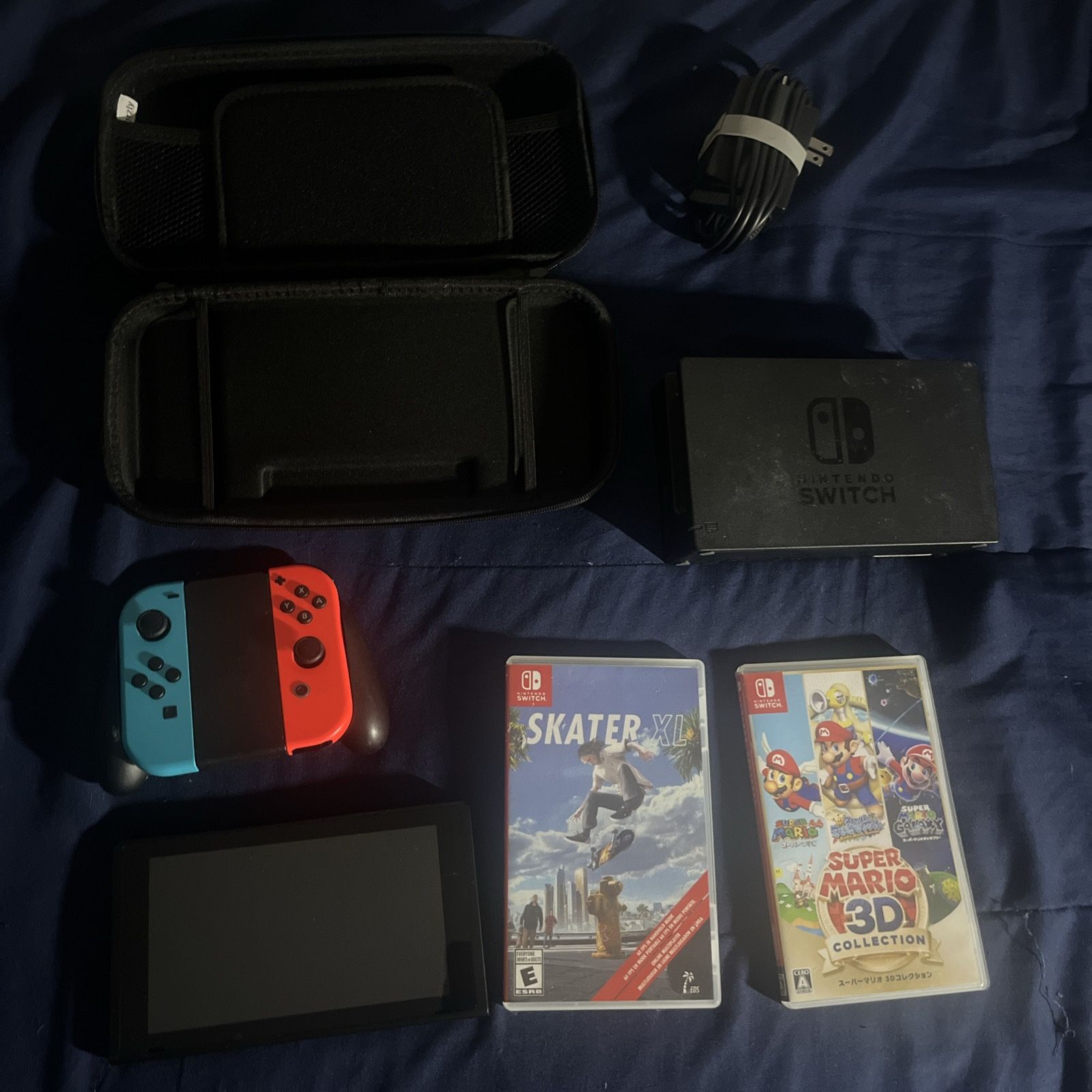 Nintendo Switch (with charger, joy-con grip), plus Super Mario 3D Collection JP, and Skate XL,