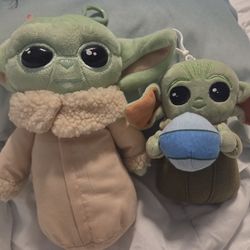 plush toys are characters from Star Wars: The Mandalorian, Grogu also known as Baby Yoda