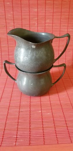 Antique pewter cream and sugar set