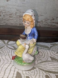 Antique Lady and Duck Porcelain Statue