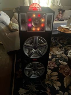 speaker has a disco ball on top works perfectly