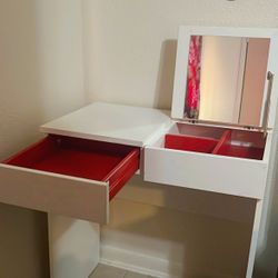 IKEA small vanity with mirror and red interior