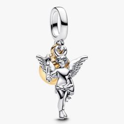 This is a Cupid Charm hand-finished in sterling silver and Gold Plating Says Rare