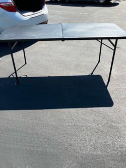 Black Folding Table W/Normal Wear & Tear(See & Click On Pictures). Still Useable