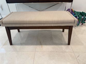 Wood bench with gray cushion