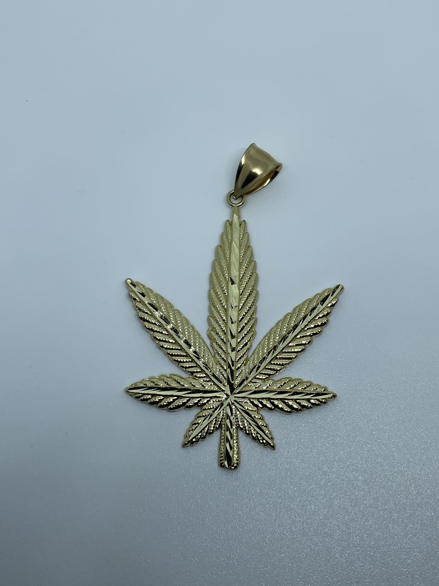 10k Marijuana Leaf Pendant With Diamond Cuts