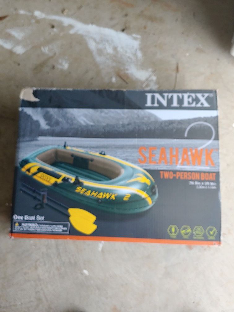 Intex Seahawk 2-person boat 7 ft 9 in by 3 never been used in a box comes with two paddles