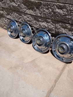 1(contact info removed) Chevy C10 OEM Hubcaps set of four