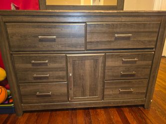 Wooden dresser with a mirror