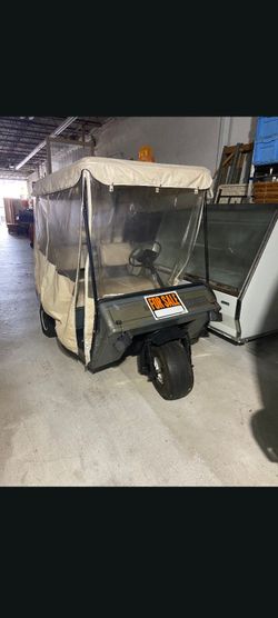 Golf Cart needs batteries has charger.