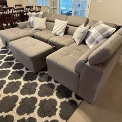 Tan suede sectional couch with ottoman and storage