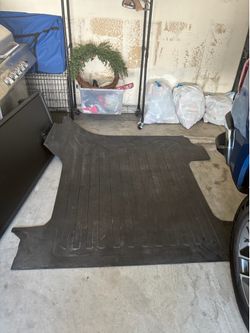 Bed Mat in black with GMC logo for short bed models
