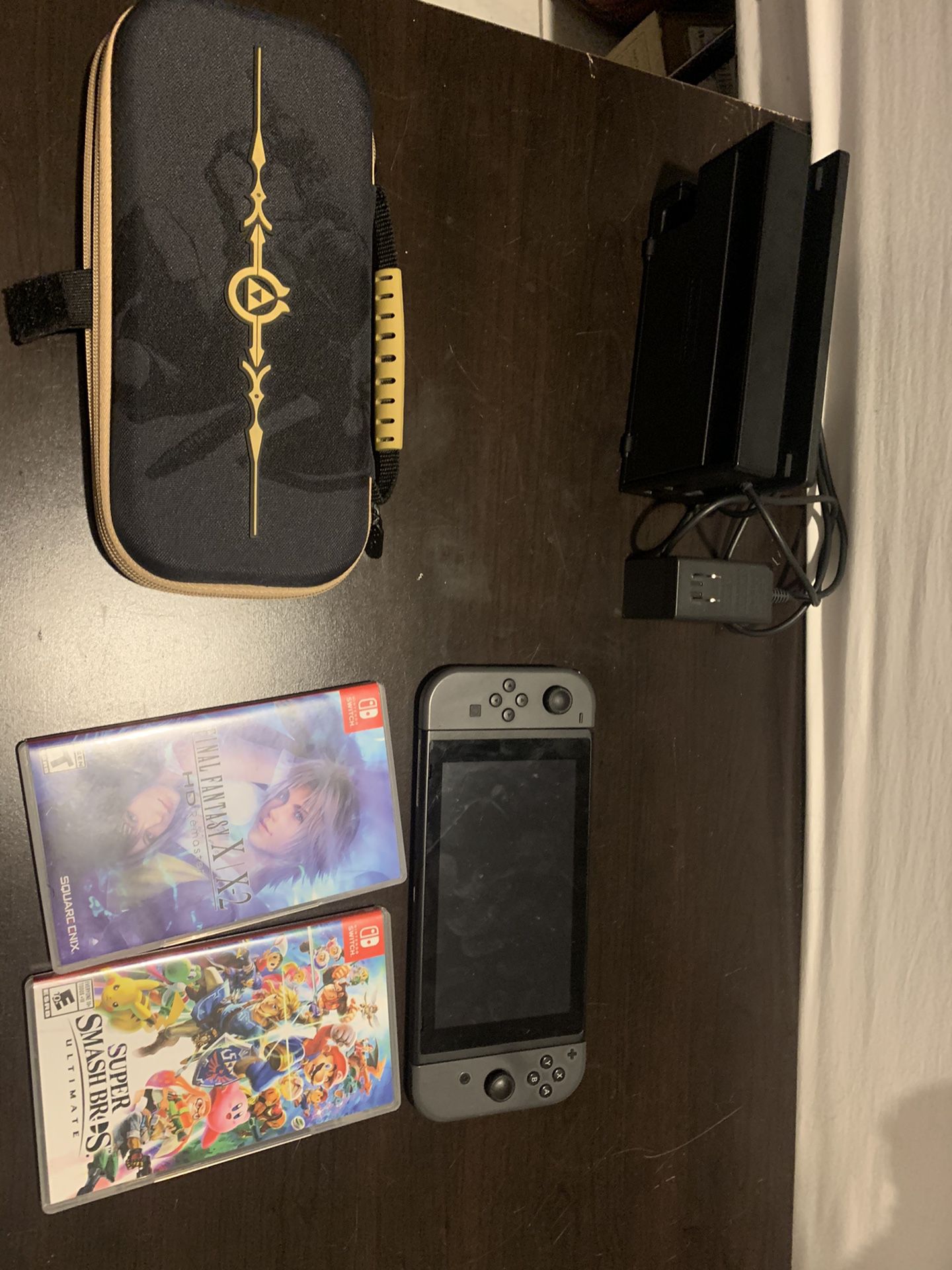 Nintendo Switch with case and games.