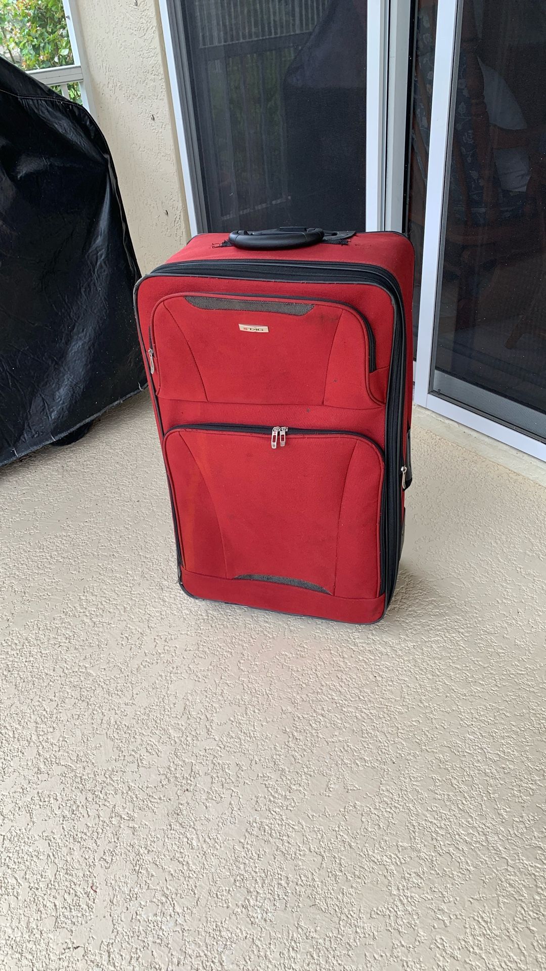 Red Luggage With Collapsible Handle And Wheels