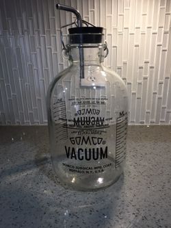 Antique suction vacuum bottle for body fluids