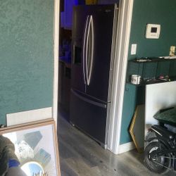 French door style whirlpool stainless steel icemaker fridge freezer on the bottom