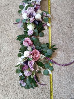 2 Artificial Flower Garland wreaths for table decor

Condition is used twice

Measurement of each arrangement left to right
Longest: 134 Inches long a