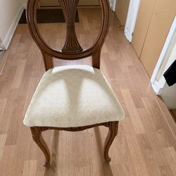 Carved oval back upholstered dining or accent chair.