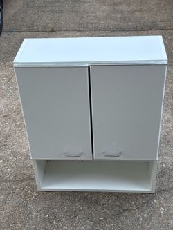 Over the toilet storage cabinet like new