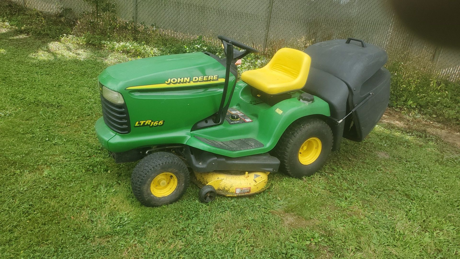 John Deere LTR166 rear bagger. Runs and mows great