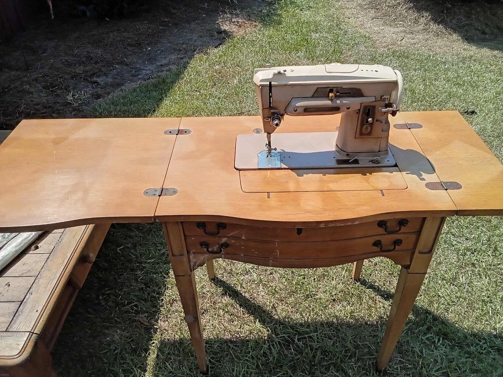 Antique Sewing Machine And Table