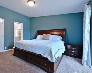 King size sleigh bed with matching side tables