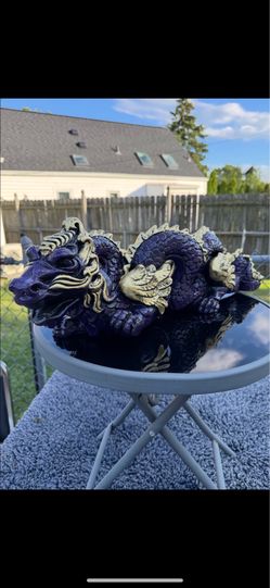 The mystical purple dragon statue