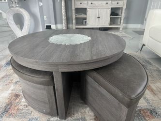 Darien Gray Cocktail Table With Storage Ottomans