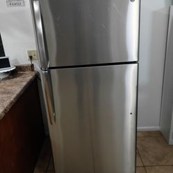 GE, STAINLESS  STEEL  REFRIGERATOR. 28"wide   29"deep    64"tall