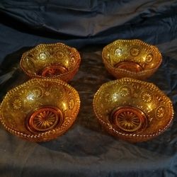 Set Of Four Amber Antique Bows