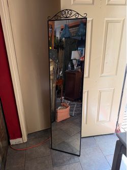 Black metal wall mirror 66 1/2 tall 16 wide