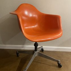 Modernica Case Study Orange Fiberglass Rolling She’ll Chair