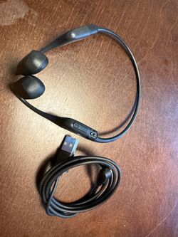 Aftershokz headphones. Bone conducting