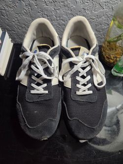 New Balance 237 in a "Black/Rain Cloud/White" or similar neutral colorway.