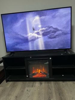 65 inch 4k ultra had tv with HDR & fireplace stand