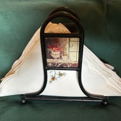 Black Metal With Porcelain Inserts and Embroidered Napkins