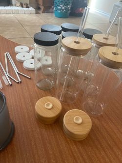 Glass jars with lids and straws