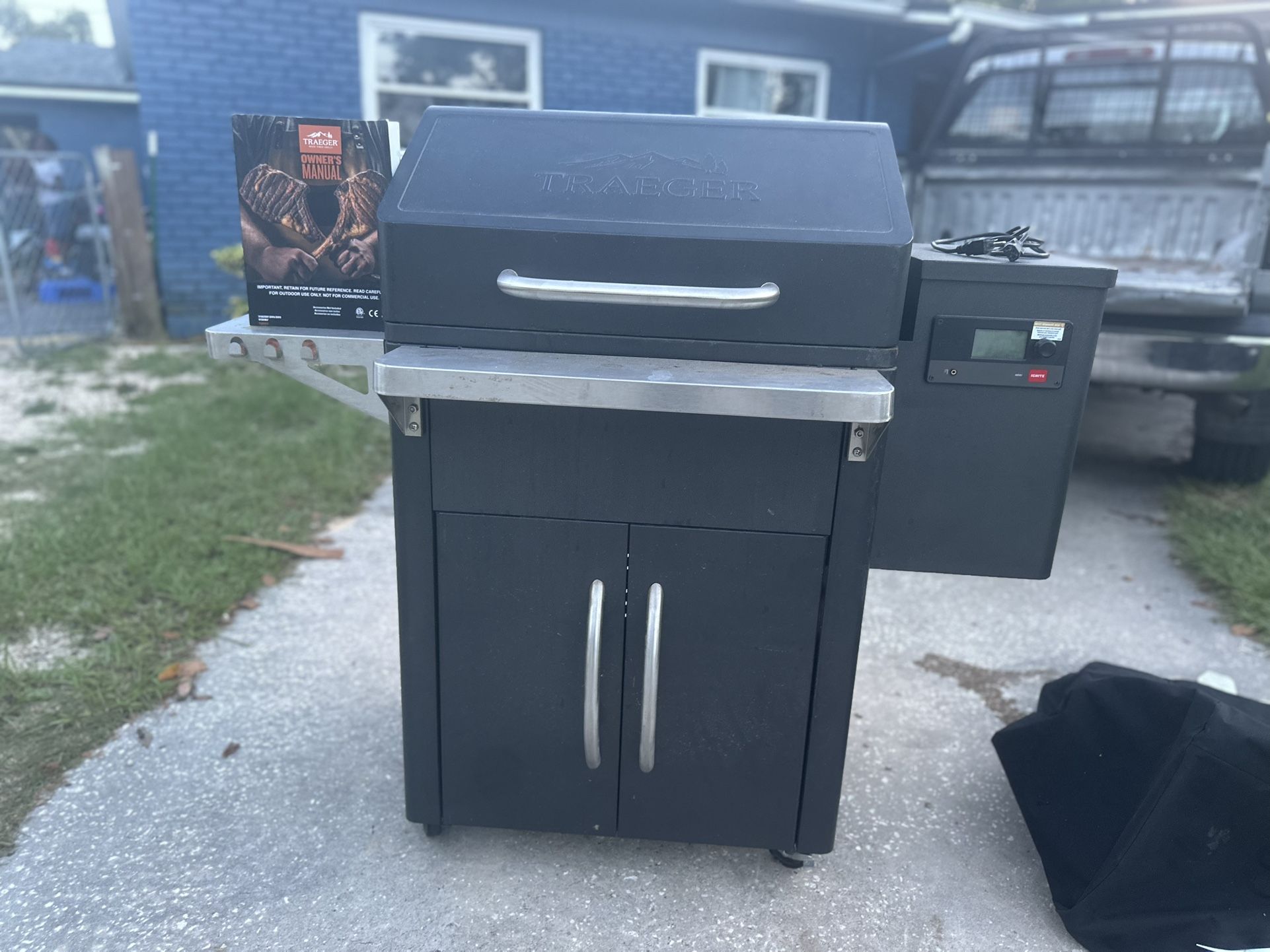 Traeger grill with owner's manual included.