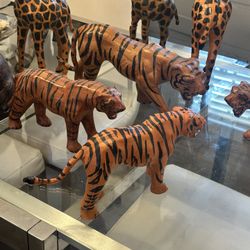 Four vintage leather tigers