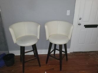 Leather swiveling bar chairs